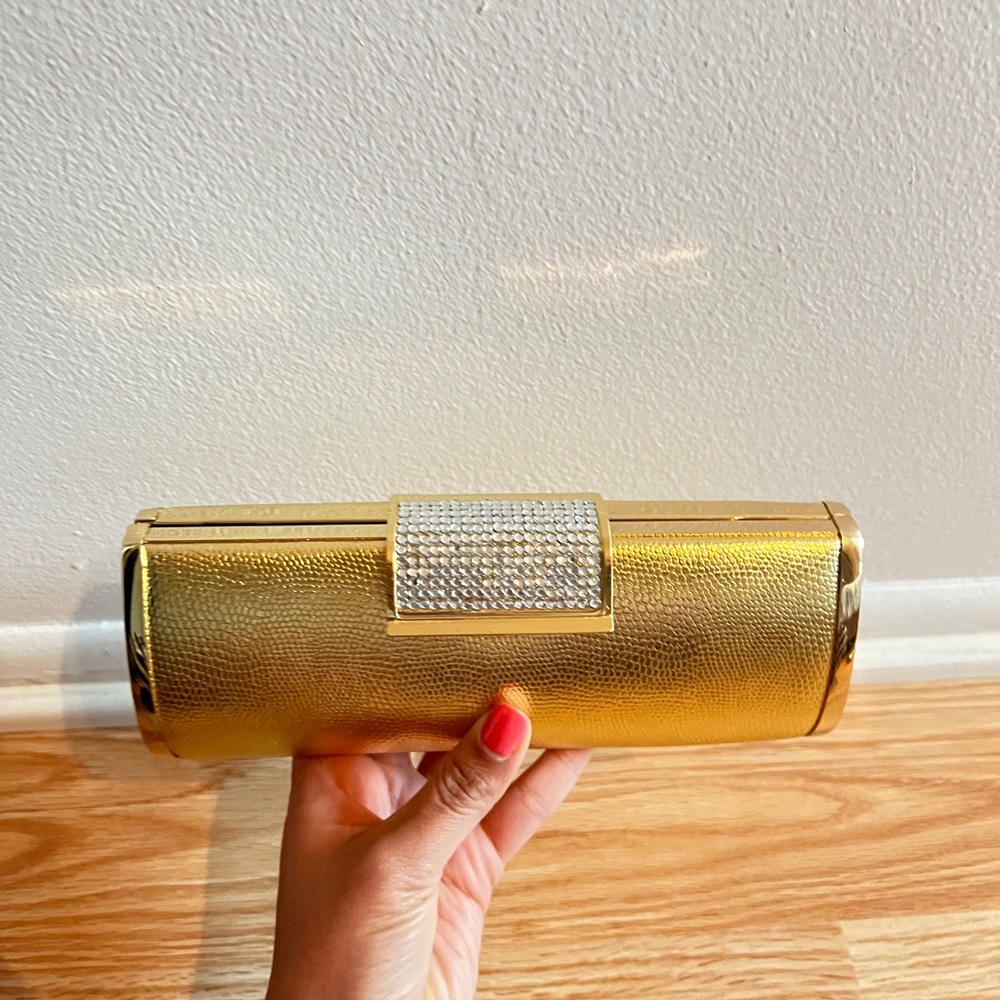 Gold clutch with a flap buckle